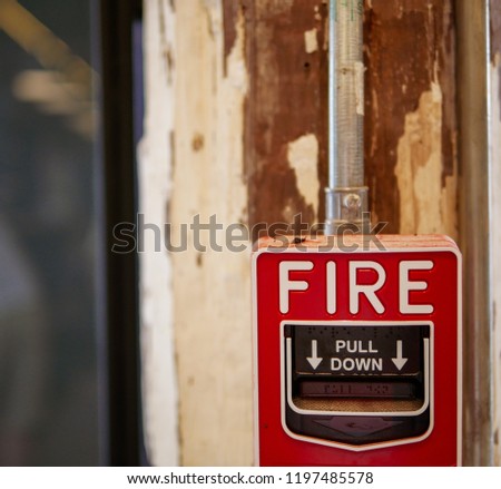 fire alarm box on the wood wall