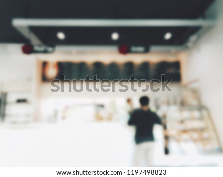 Blurred image background of man buying coffee in coffee shop