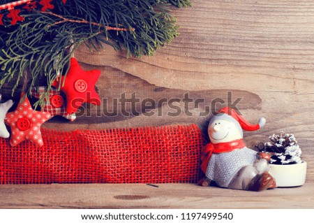 Christmas still life. Red toys, spruce branches and decorative Christmas ornaments 