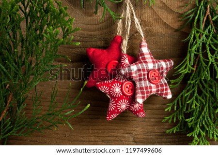 Christmas still life. Red toys, spruce branches and decorative Christmas ornaments 