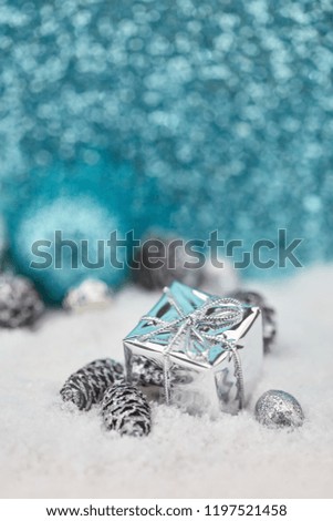 Christmas present on the snow as card background