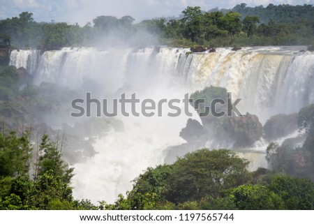 Iguazú Falls, Argentina - December 19th 2014: waterfalls  on the border of the Argentine province of Misiones and the Brazilian state of Paraná. The largest waterfall system in the world.