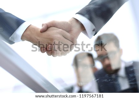 businessmen shaking hands closeup.business background