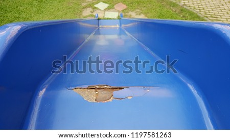Broken playground slide from top view