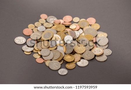 Coins Money US dollars and Euros on a gray background, different monetary coins