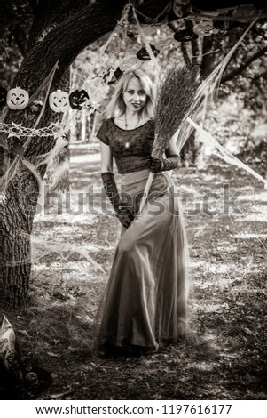 Halloween party concept, mysterious girl in  handmade dress vintage style. Beautiful young dark witch woman. Inspiration for halloween celebration, ideas and simple nice detail