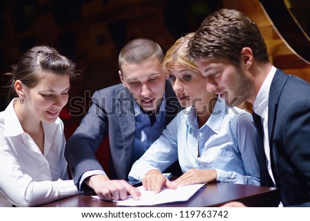 Group of happy young  business people in a meeting at office