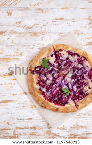 Traditional sweet pizza with berries and pineapple on wooden background. Selective focus.
