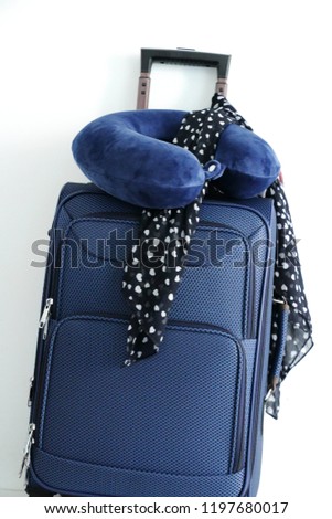 travel bag,blue travel pillow  and  heart print black and white scarf  isolated on white background,travel lifestyle concept. Royalty-Free Stock Photo #1197680017