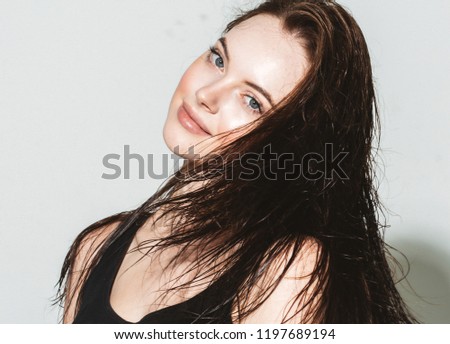Brunette woman with long hair beautiful face portrait