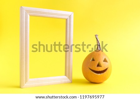 Halloween pumpkin with photo frame minimal abstract creative concept.