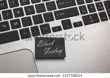 Post and marketing message of black friday sale on laptop.