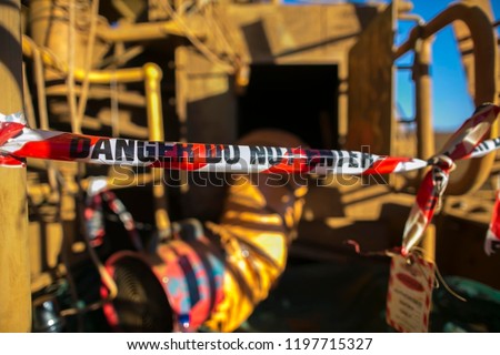 Danger red and white tape barricade  exclusion area at confined space entry door authorised personnel only at construction site Sydney city, Australia   
