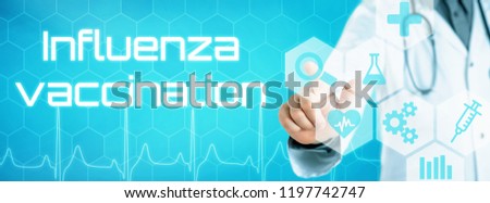 Doctor touching an icon on a futuristic interface - Influenza vaccination