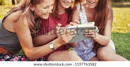 summer shopping online, people using social media, group of girls friends looking at tablet computer and smiling