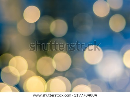 Abstract yellow blue light bokeh background for Christmas, Birthday, anniversary refocused blurred background.