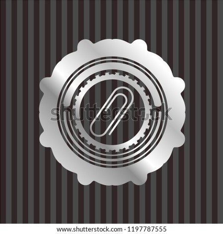 paper clip icon inside silver badge