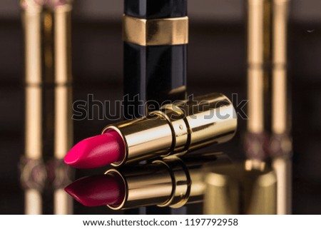 Lipstick. Fashion Colorful Lipsticks over black background. Professional Makeup and Beauty. Beautiful Make-up concept. Lipgloss. Lipsticks closeup