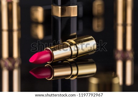 Lipstick. Fashion Colorful Lipsticks over black background. Professional Makeup and Beauty. Beautiful Make-up concept. Lipgloss. Lipsticks closeup