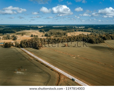 drone image. aerial view of rural area with green cultivated fields in summer day, shadows from clouds - vintage retro look