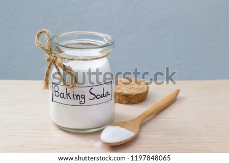 baking soda on wooden table Royalty-Free Stock Photo #1197848065
