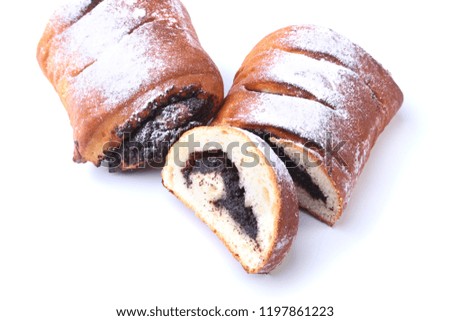 Poppy seed and walnut rolls, traditional Chistmas beigli cake isolated on white background.