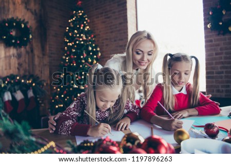 December vacation childhood moments. Parent mama spend free time with small cute lovely pre-teen offspring in sweater create pencil dreamy winter fairy eve noel sit wooden table living room comfort