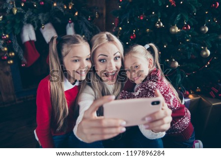 Celebrate noel December winter eve vacation! Leisure enjoy crazy parent mama emotions reaction face make picture with small little glad stylish blonde pre-teen in sweater chill indoor fancy house