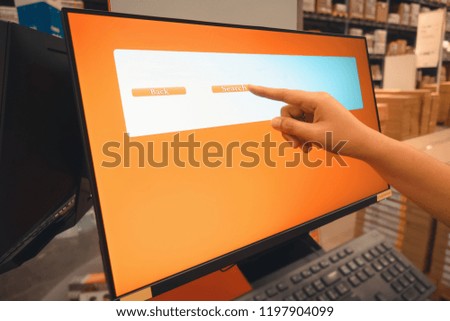 Close-Up of Woman Hand is Typing Information on Monitor Computer for Searching Personal Data in Department Store. Female Hand Touching Touchscreen Interactive Display Media Connection on Computer PC.