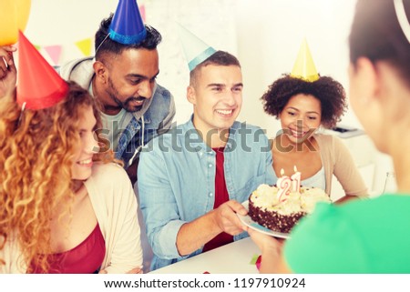 corporate party and people concept - happy team with cake and non-alcoholic drinks celebrating colleague 21st birthday at office