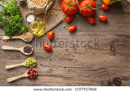 A Low key picture of Healthy food background ,fruits and vegetables on old wooden table.