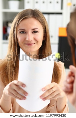 Smiling woman offer contract form on clipboard pad and silver pen to sign closeup. Strike a bargain for profit white collar motivation union decision corporate sale insurance agent concept
