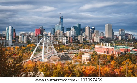 Skyline of Edmonton - capital of Alberta, the oil city, on North Saskatchewan River during colourful, vivid autumn, fall. Sunny day, panorama layout. Royalty-Free Stock Photo #1197997456