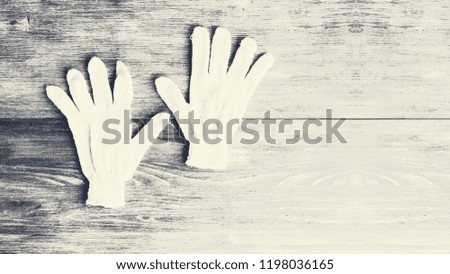 Concept of handicraft, non-business jobs, craft, manual skill. Work gloves on wooden background. Copy space.