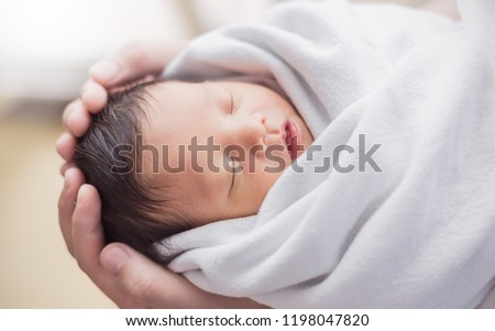 Portrait of asian parent hands holding newborn baby fingers, Closeup mother’s hand holding their new born baby. Love family healthcare and medical body part nursery together happy mother’s day concept Royalty-Free Stock Photo #1198047820