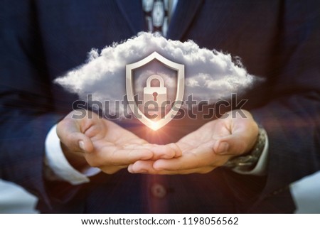 Businessman shows a Security system of the cloud data .