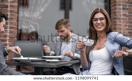 modern business woman sitting at the coffee table