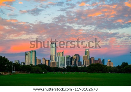 Sunset at Zilker Park Austin Texas glowing city at golden hour green public space and tall modern skyscrapers skyline cityscape