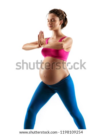 Beautiful expectant girl meditating with her palms together isolated on white background. Concept of healthy life
