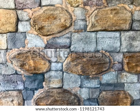 Decorative wall of colored stone bricks. Studio Photo