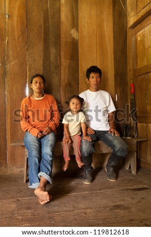 A Quechua family of cocoa farmers in 3rd world Ecuador, living in poverty with their colorful children, struggling to survive in a harsh world. Royalty-Free Stock Photo #119812618