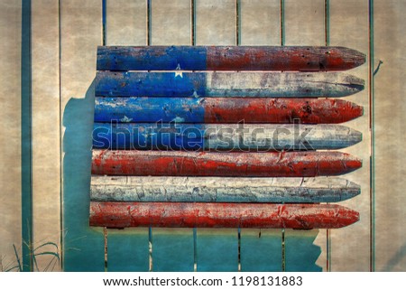 Rustic decorative background with American flag made of wooden slats and put on a fence. Boonsboro, Maryland, USA. Vintage processing.