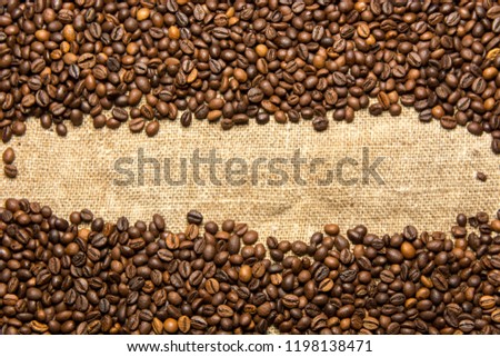 coffee beans lie on burlap background