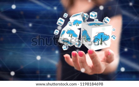 Cloud networking concept above the hand of a woman in background
