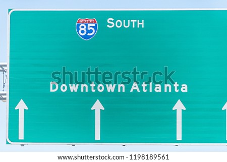 Atlanta, USA I-85 Interstate 85 highway road street during day in capital Georgia city, closeup of isolated green sign for downtown directions arrows Royalty-Free Stock Photo #1198189561