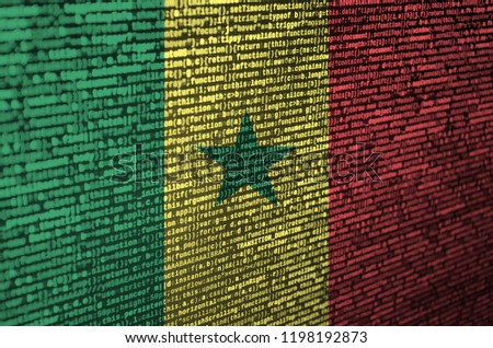 Senegal flag  is depicted on the screen with the program code. The concept of modern technology and site development