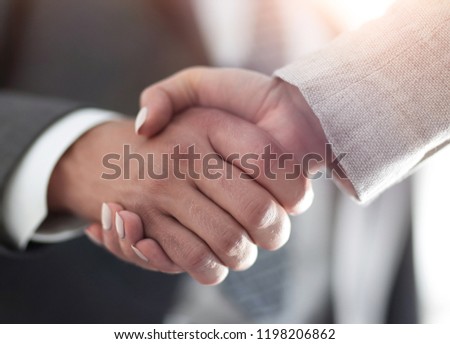 Businessmen handshaking after successful business meeting Royalty-Free Stock Photo #1198206862