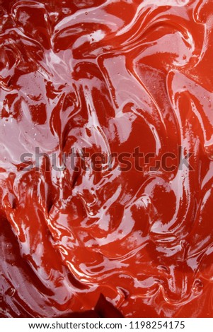 Image of a red coloured abstract background,liquid mixture of cement and red oxide used for concrete flooring, for backgrounds and wallpaper, India, Odisha