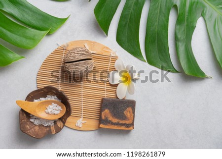 Aromatherapy  product  Spa set, flat lay composition.Tropical leaf concept style., massage with pink background. top view.Monstera leaves template, tropical summer fashion background.