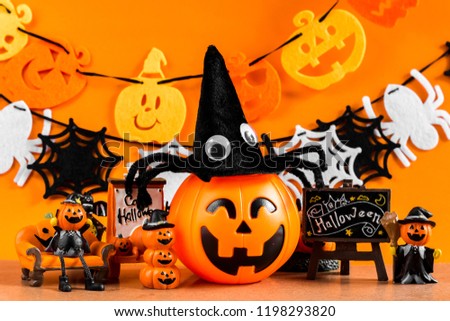 Halloween toys on background by the decoration halloween. Decoration of the decor in Halloween and orange background.